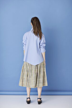 Light blue shirt with asymmetric closure from YaccoMaricard