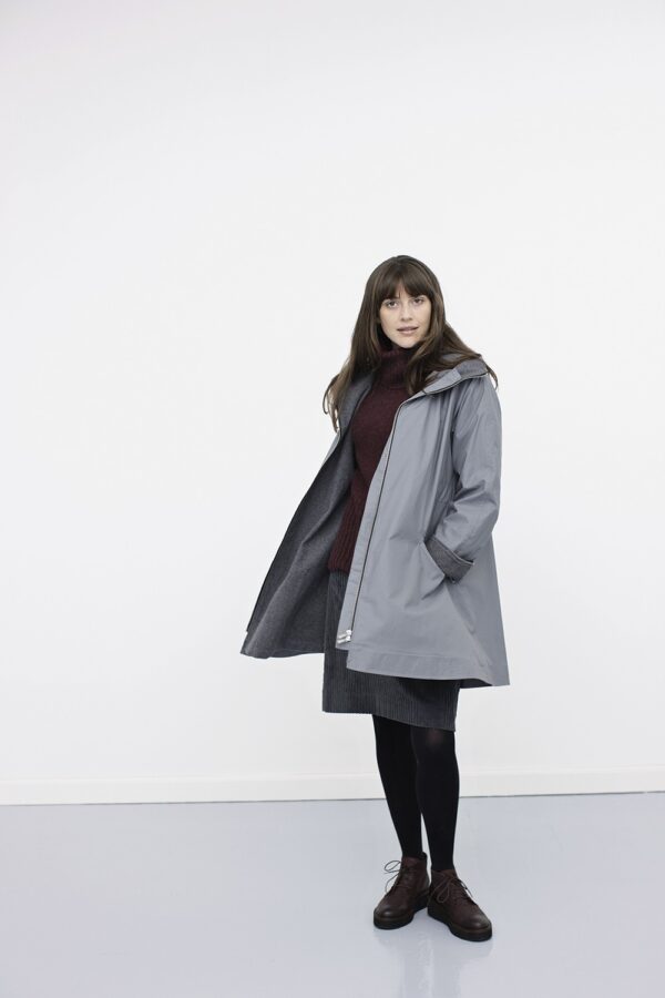 Light grey raincoat with zipper and hood