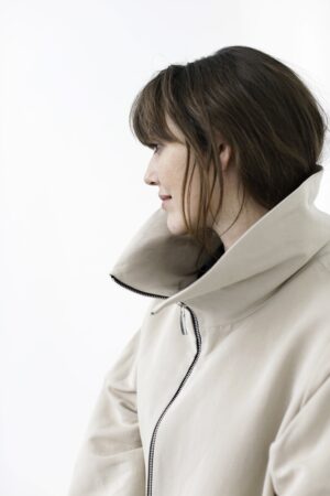 Oversize sand coloured spring coat with sculptural collar