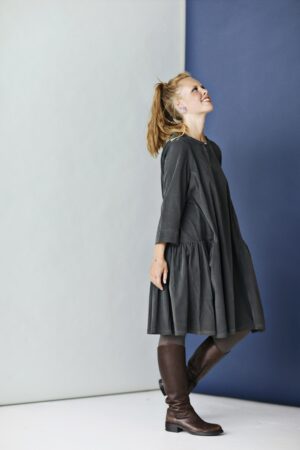 Grey corduroy dress with A-line silhouette and ruffle