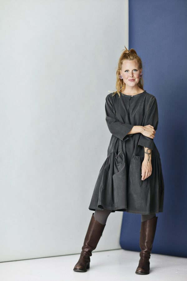Grey corduroy dress with A-line silhouette and ruffle
