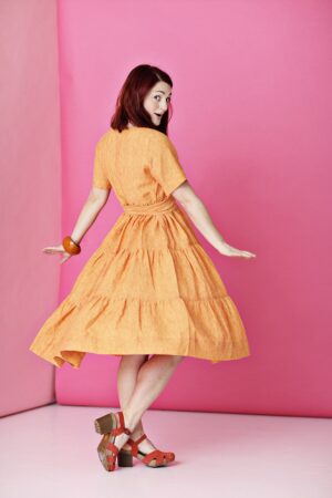 Orange ruffle dress in linen