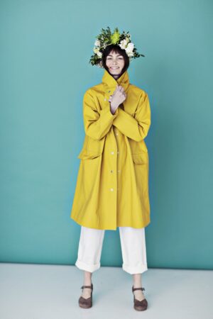 Yellow raincoat in coated linen