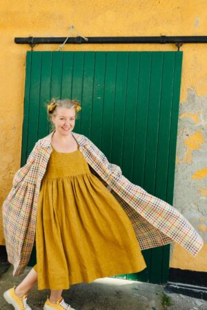 Yellow linen dress with wrinkles