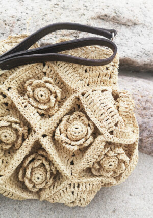 Crossover bag with crocheted flowers