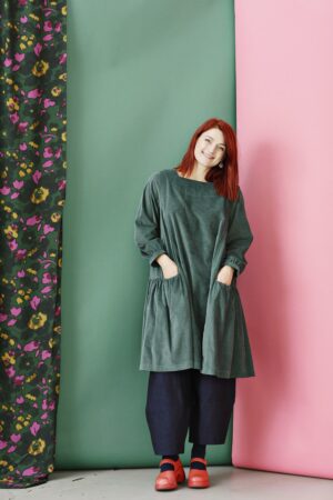 Green corduroy dress with A-line silhouette
