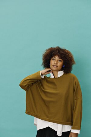 dark mustard knit with batwing sleeves.